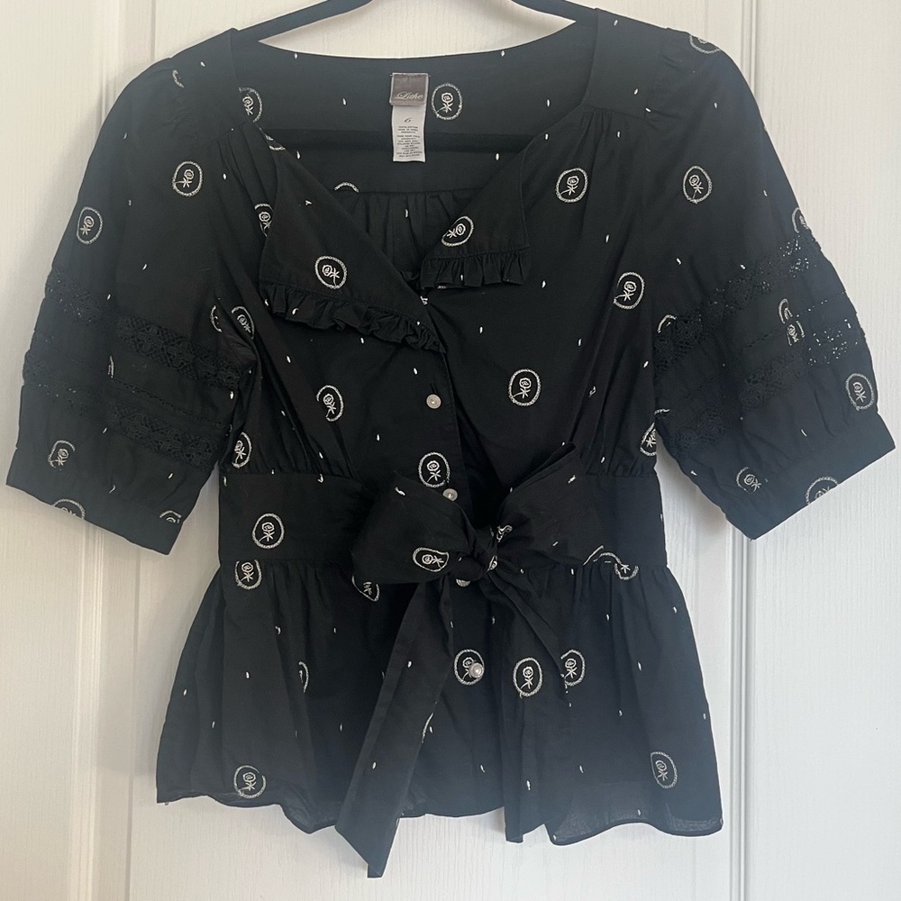 Black short sleeved blouse with flowers